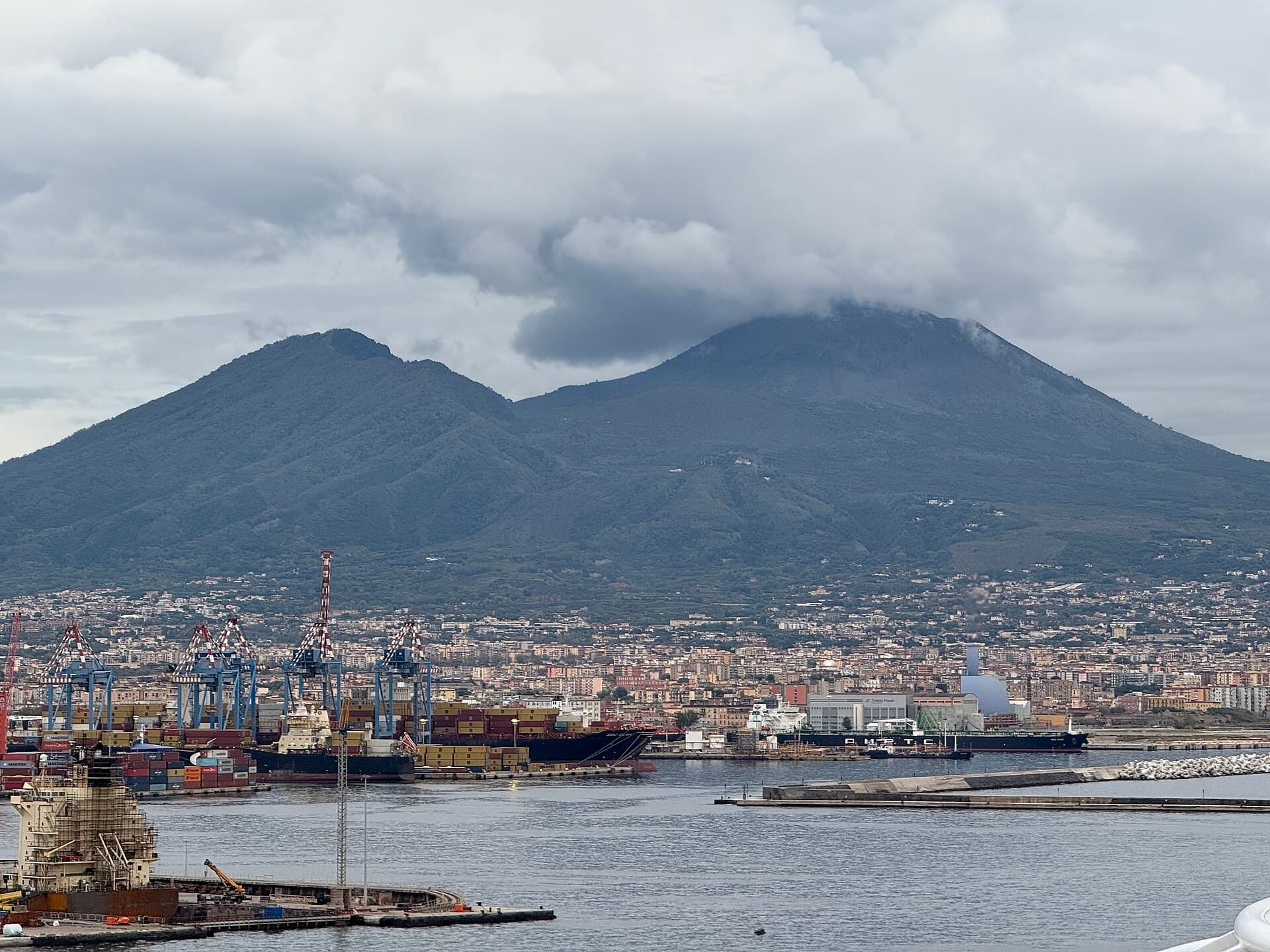 Mount Vesuvius rising above the modern city and port of Naples.